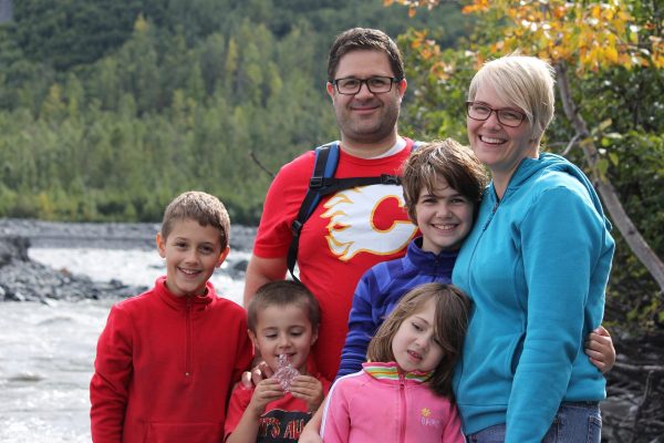 family-next-to-riverbed